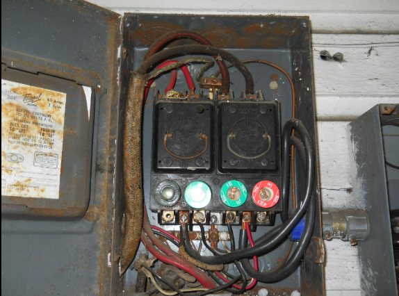 Rusty old electrical panel in need of replacement 