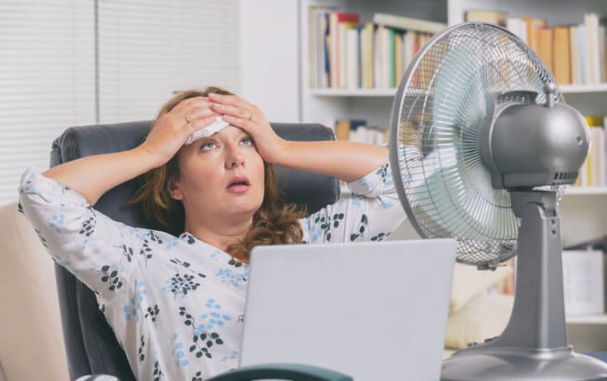 Office Woman sweating during a heatwave