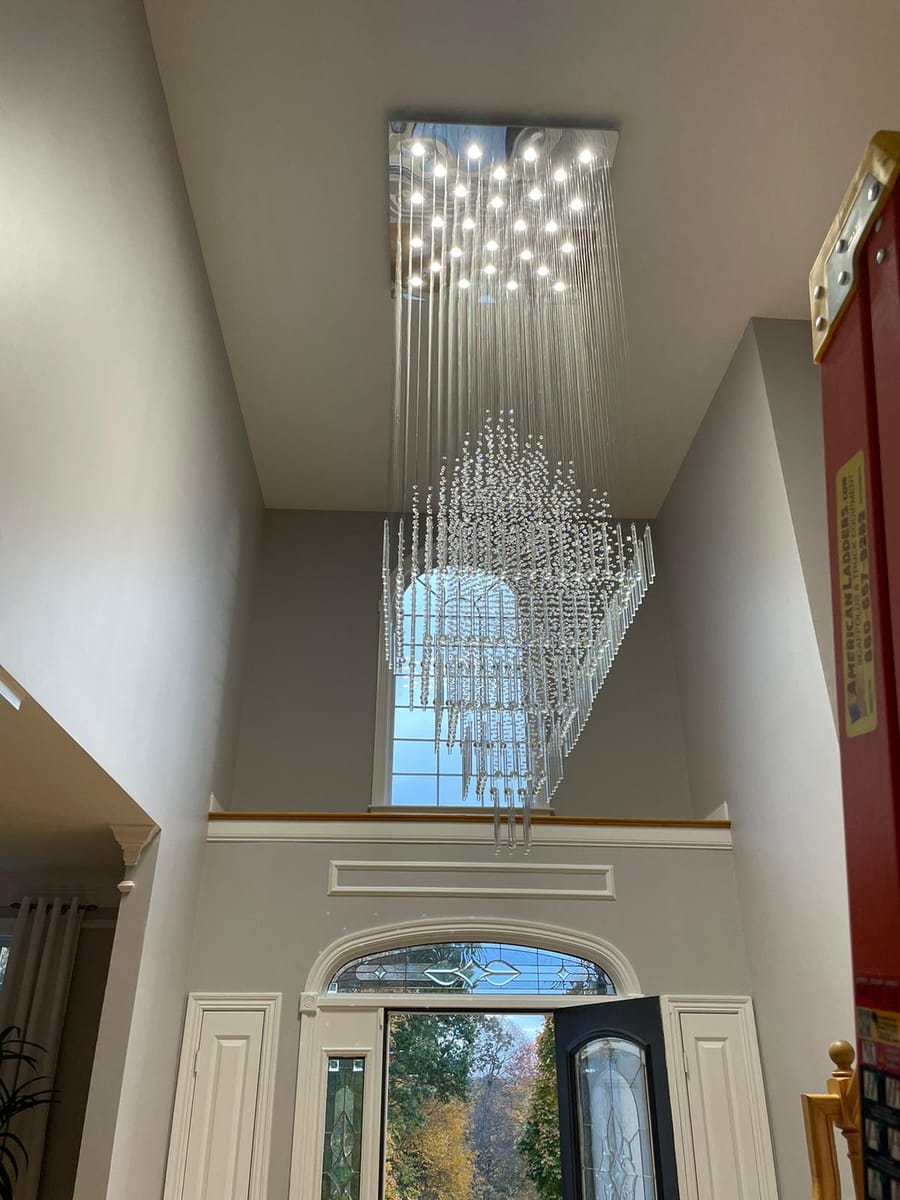 A chandelier hanging in an entryhall