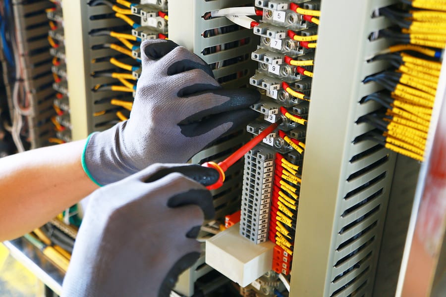 Electrician working on junction box.