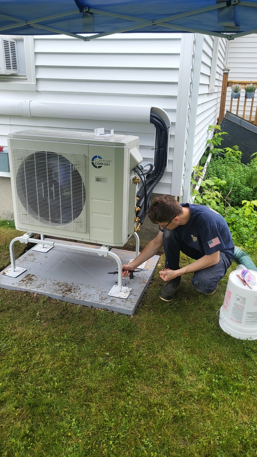 HVAC tech repairing outdoor ac unit