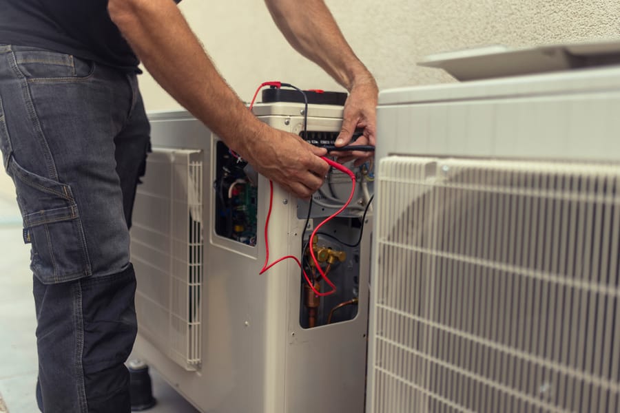 Tech repairing an open heating system