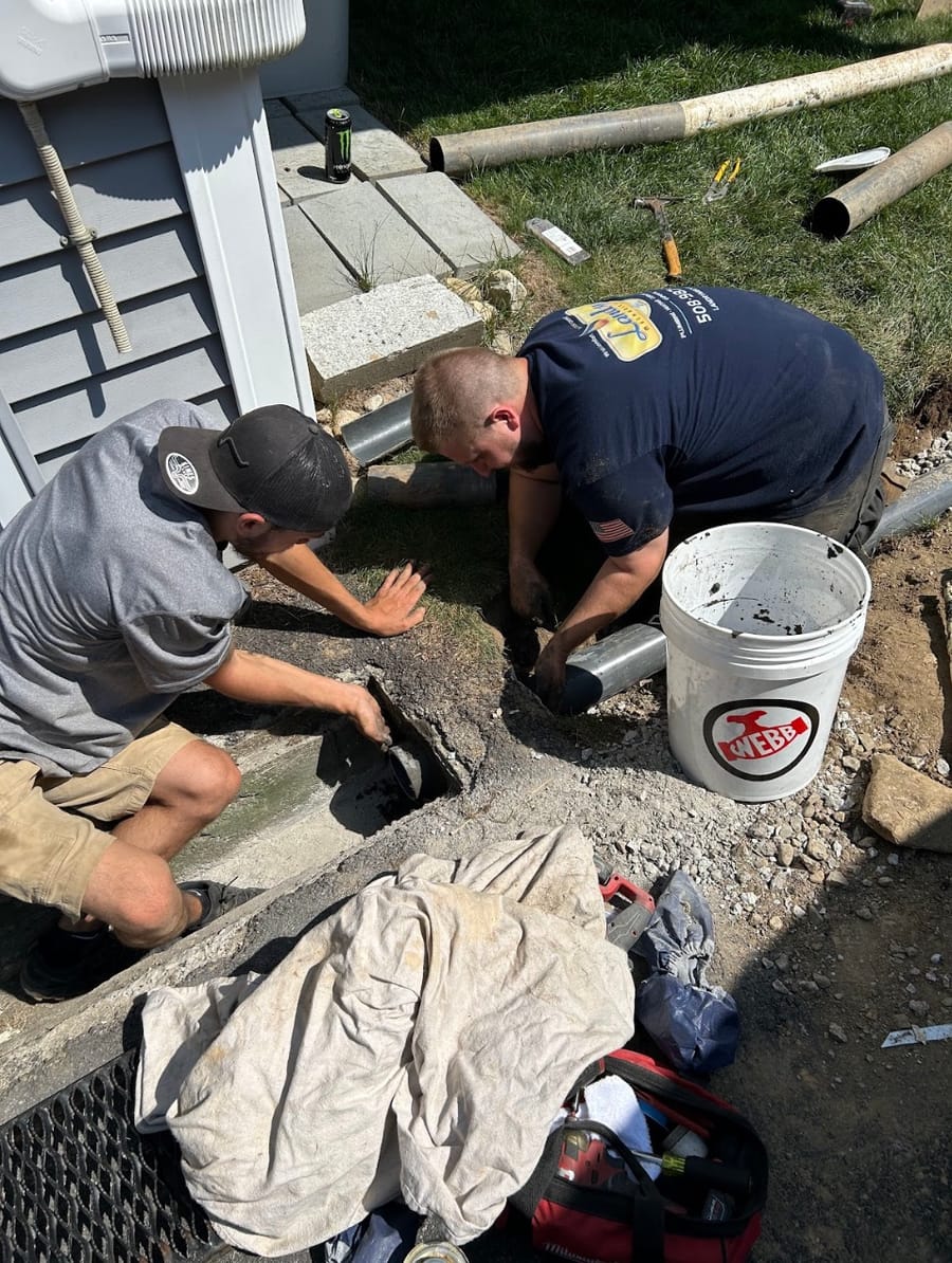 Landry plumbers replacing sewer line.