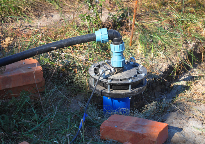 Well pump installed into the ground.