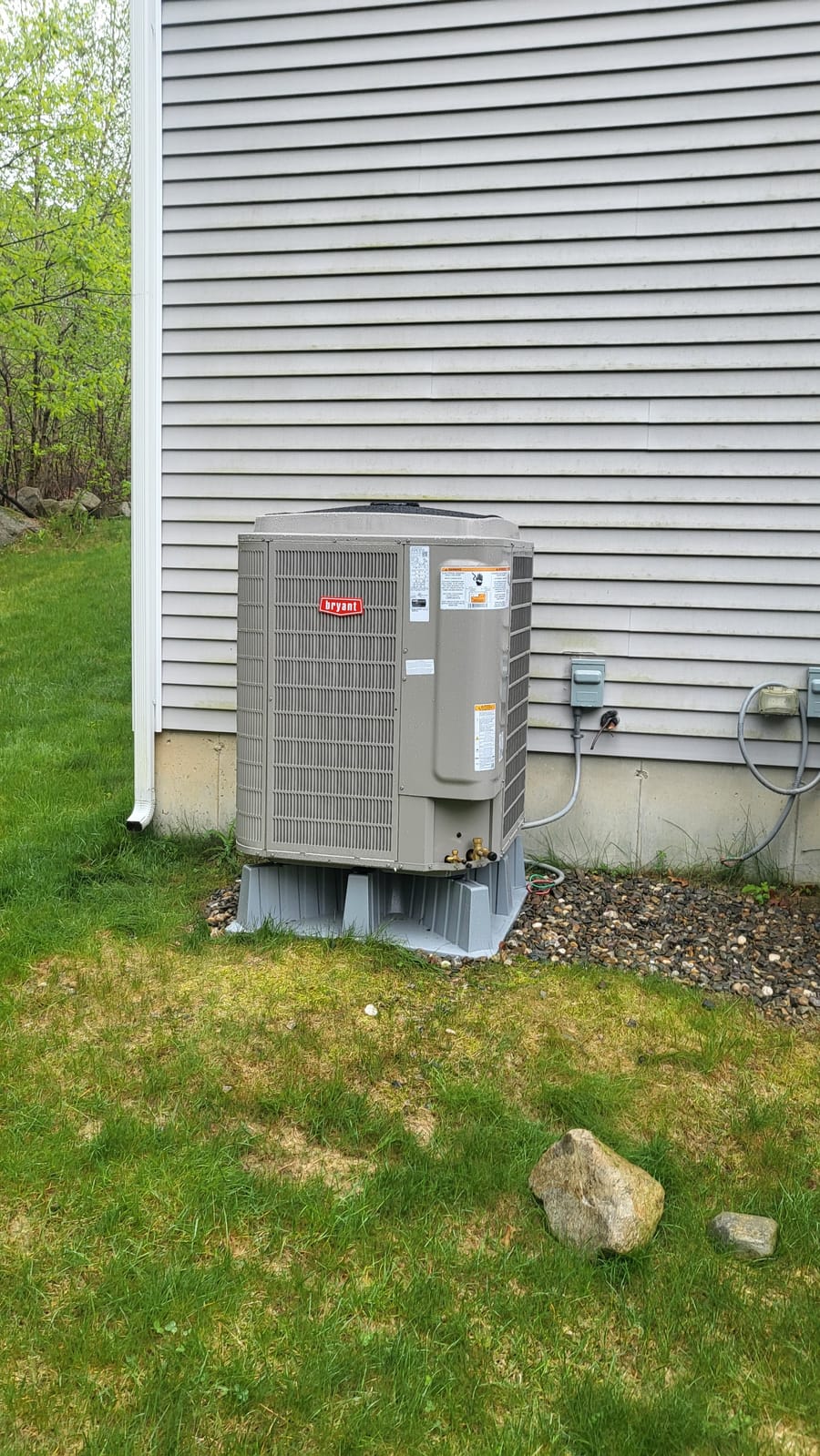 air conditioner unit sitting outside house